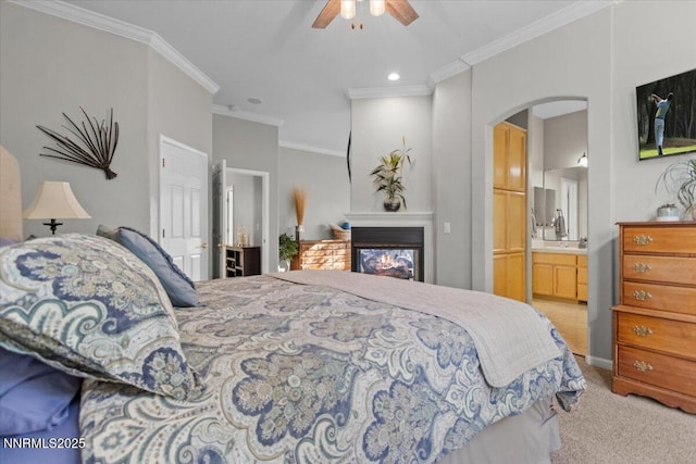 3215 Epic Ave, Reno, NV 89512 - bedroom featuring light carpet, arched walkways, crown molding, a glass covered fireplace, and ensuite bathroom