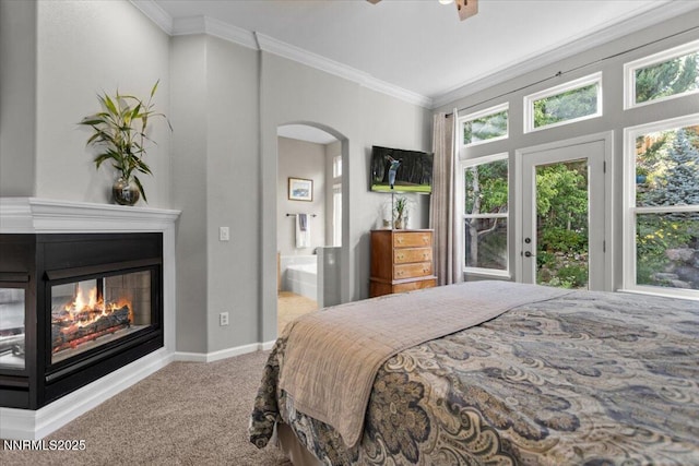 3215 Epic Ave, Reno, NV 89512 - carpeted bedroom featuring arched walkways, access to outside, ornamental molding, multiple windows, and connected bathroom