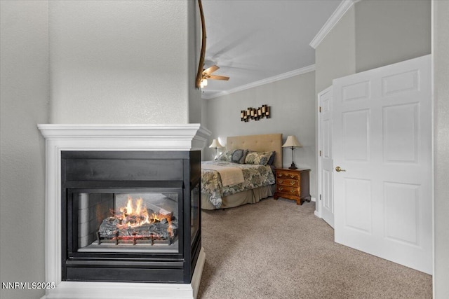 3215 Epic Ave, Reno, NV 89512 - bedroom with crown molding, a lit fireplace, carpet floors, and ceiling fan