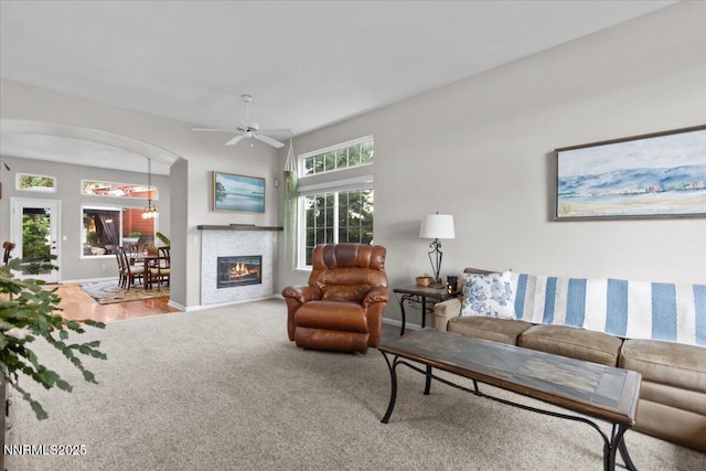 3215 Epic Ave, Reno, NV 89512 - living room with carpet flooring, arched walkways, and ceiling fan