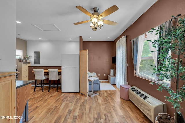 1236 Victorian Plaza Cir, Sparks, NV 89431 - kitchen with freestanding refrigerator, electric panel, healthy amount of natural light, light wood finished floors, and recessed lighting