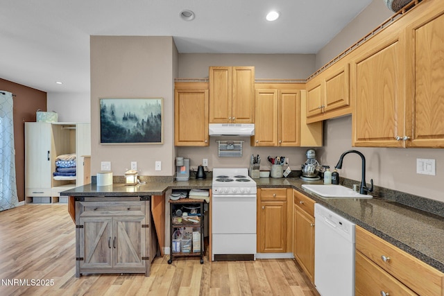 1236 Victorian Plaza Cir, Sparks, NV 89431 - kitchen with white appliances, under cabinet range hood, a peninsula, light wood finished floors, and recessed lighting