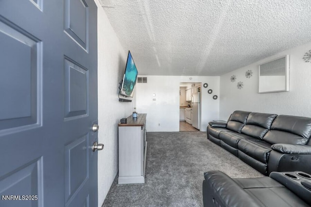 1412 E 9th St Unit 7, Reno, NV 89512 - living area featuring a textured ceiling and carpet