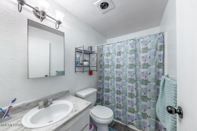 1412 E 9th St Unit 7, Reno, NV 89512 - bathroom with a textured wall, vanity, and a textured ceiling