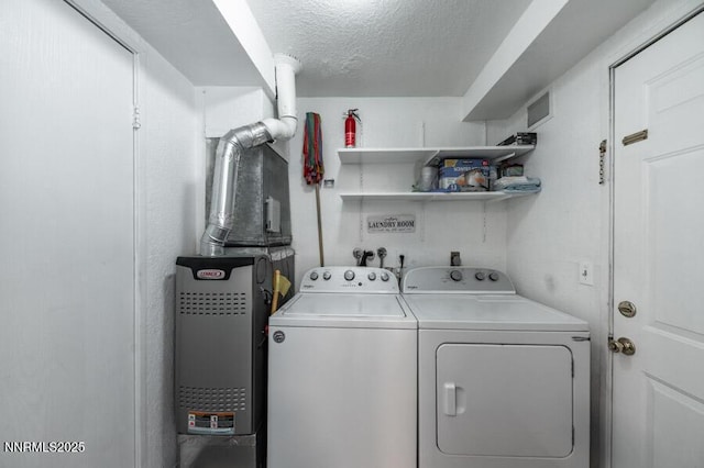 1412 E 9th St Unit 7, Reno, NV 89512 - washroom with washing machine and clothes dryer and a textured ceiling