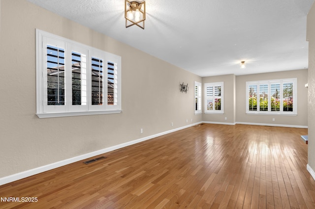 979 University Ridge Dr, Reno, NV 89512 - unfurnished living room with hardwood / wood-style floors and baseboards
