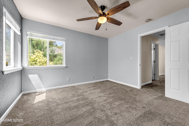 979 University Ridge Dr, Reno, NV 89512 - carpeted spare room featuring a textured wall, ceiling fan, and a textured ceiling