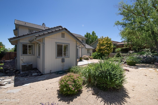 979 University Ridge Dr, Reno, NV 89512 - view of property exterior with a chimney and a patio