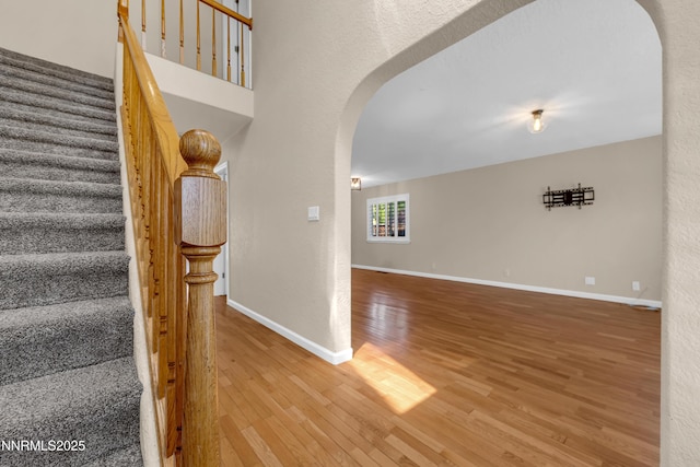 979 University Ridge Dr, Reno, NV 89512 - stairs with arched walkways and wood finished floors