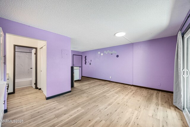2450 Lymbery St Unit 233, Reno, NV 89509 - unfurnished room with light wood finished floors and a textured ceiling