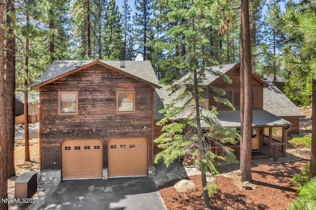 458 Center St, Zephyr Cove, NV 89448 - chalet / cabin featuring roof with shingles, a garage, driveway, and a porch