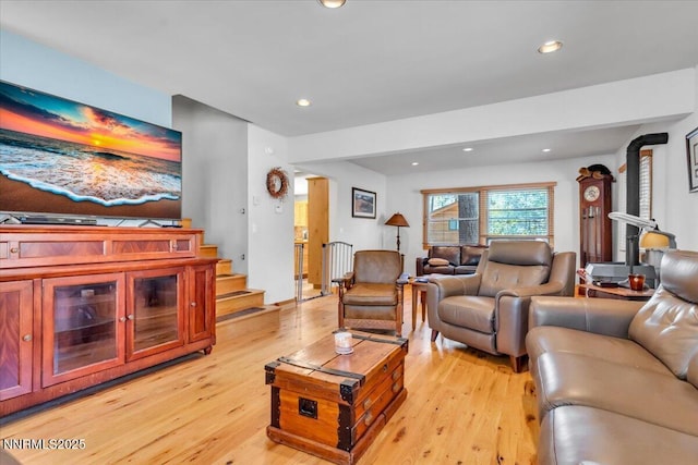 458 Center St, Zephyr Cove, NV 89448 - living area with light wood-style floors, recessed lighting, a wood stove, and stairway