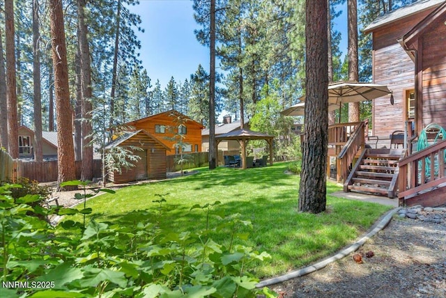 458 Center St, Zephyr Cove, NV 89448 - view of yard featuring a gazebo, a deck, and a storage unit