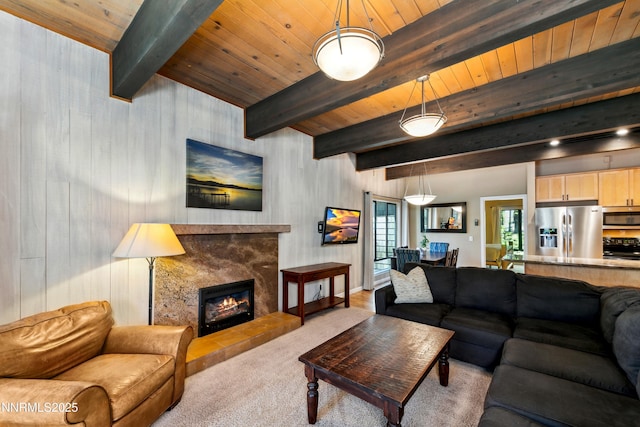 136 Juanita Dr Unit 47, Incline Village, NV 89451 - living area with a wooden ceiling with exposed beams, a high end fireplace, carpet flooring, and wooden walls