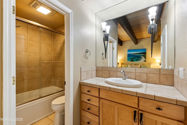 136 Juanita Dr Unit 47, Incline Village, NV 89451 - full bath featuring vanity, bath / shower combo with glass door, tile patterned flooring, a textured wall, and a wood ceiling with exposed beams