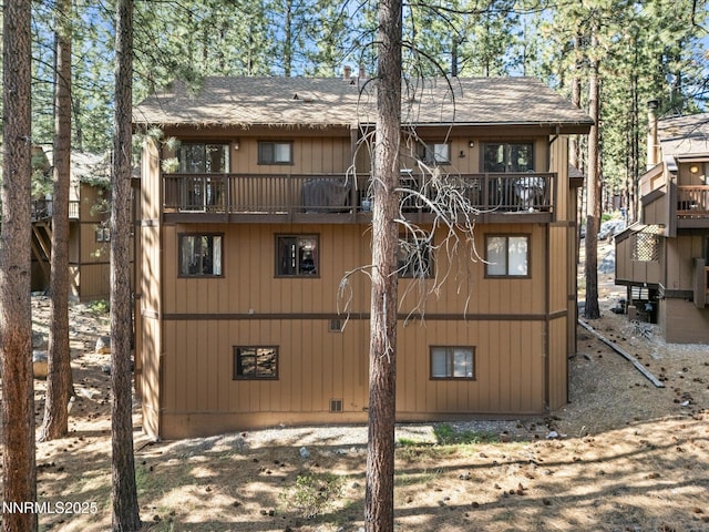 178 Tahoma Cir Unit B, Zephyr Cove, NV 89448 - back of house featuring a balcony and a shingled roof