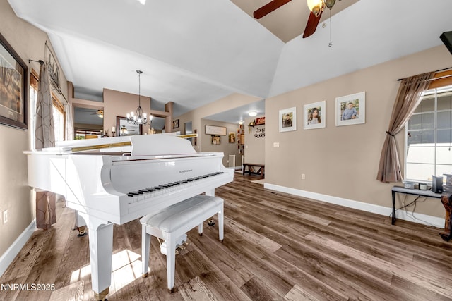 1450 Talon Ct, Spanish Springs, NV 89441 - sitting room featuring lofted ceiling, a ceiling fan, wood finished floors, a chandelier, and plenty of natural light