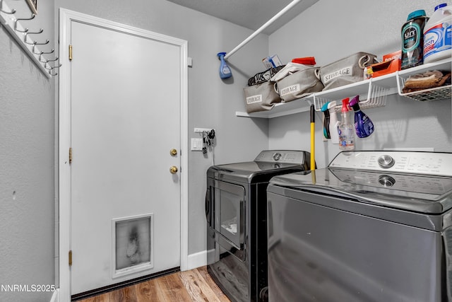 1450 Talon Ct, Spanish Springs, NV 89441 - laundry area featuring independent washer and dryer and wood finished floors