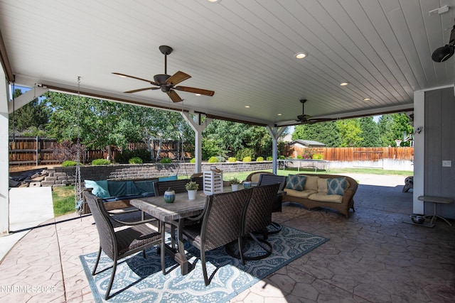 1450 Talon Ct, Spanish Springs, NV 89441 - fenced backyard with a patio, a ceiling fan, outdoor dining space, and an outdoor living space