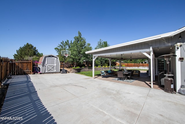 1450 Talon Ct, Spanish Springs, NV 89441 - fenced backyard with a patio area, outdoor dining space, a storage shed, and ceiling fan