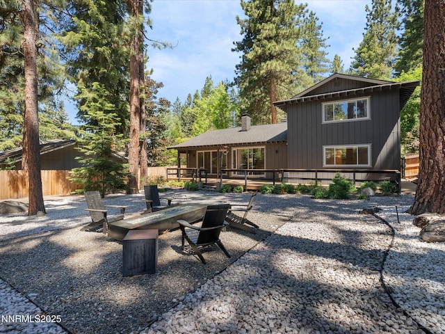 189 Ray Way, Zephyr Cove, NV 89448 - back of house featuring a fire pit, a deck, and a chimney