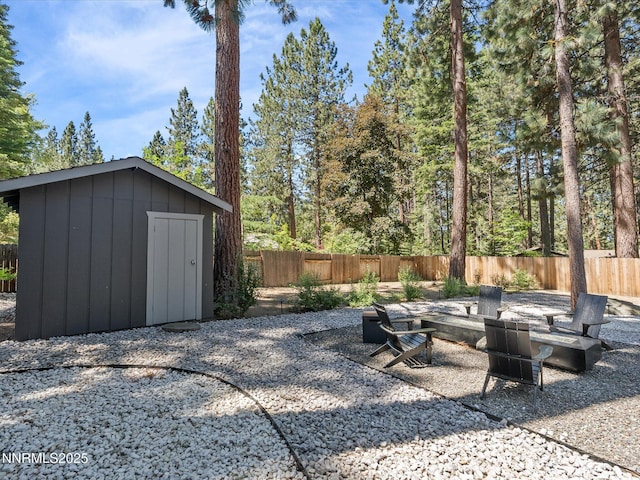 189 Ray Way, Zephyr Cove, NV 89448 - fenced backyard with a storage unit and a patio area