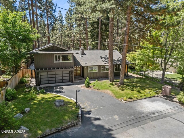 189 Ray Way, Zephyr Cove, NV 89448 - view of front of property with driveway, an attached garage, a shingled roof, and a chimney