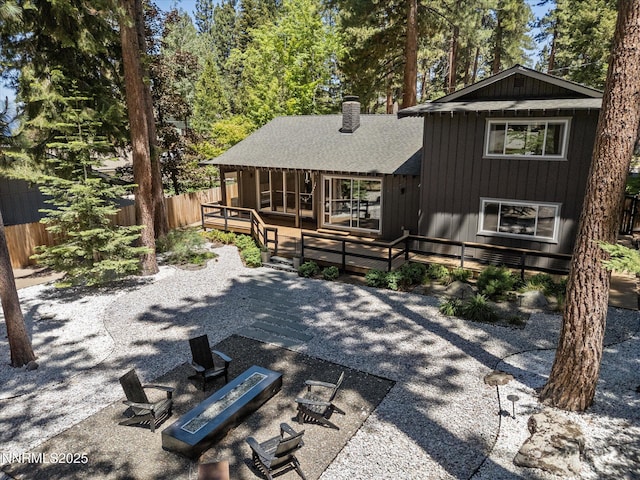 189 Ray Way, Zephyr Cove, NV 89448 - back of property featuring a deck, a chimney, a patio, and an outdoor fire pit