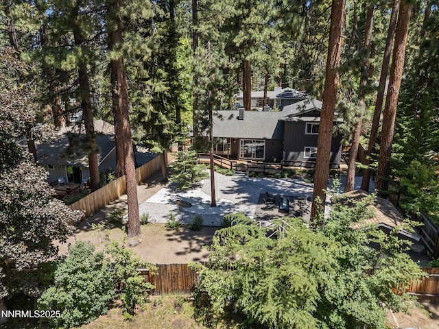 189 Ray Way, Zephyr Cove, NV 89448 - back of property with a fenced backyard, a deck, a patio, and a shingled roof
