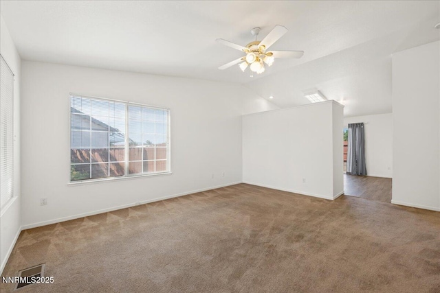 7202 Leonardo Ct, Sun Valley, NV 89433 - empty room with carpet flooring, vaulted ceiling, and ceiling fan