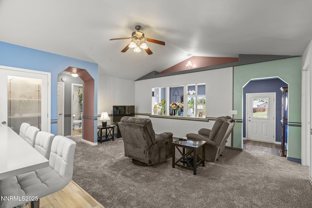 610 Hunter Park Way, Fallon, NV 89406 - carpeted living area featuring arched walkways, a ceiling fan, lofted ceiling, and wood finished floors