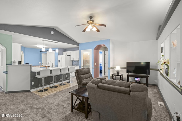 610 Hunter Park Way, Fallon, NV 89406 - carpeted living area featuring ceiling fan and lofted ceiling