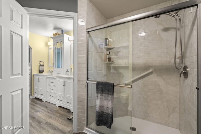 610 Hunter Park Way, Fallon, NV 89406 - bathroom with double vanity, wood finished floors, and a shower stall