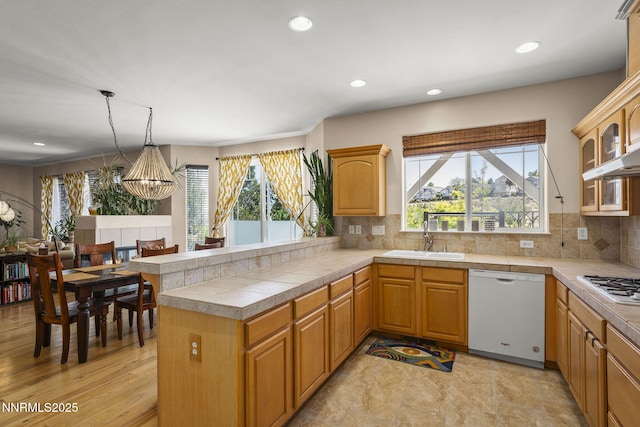 3744 Ranch Crest Dr, Reno, NV 89509 - kitchen featuring white appliances, recessed lighting, decorative backsplash, glass insert cabinets, and a chandelier