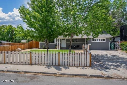 1203 Stanford Way, Sparks, NV 89431 - view of front of house featuring a fenced front yard and driveway