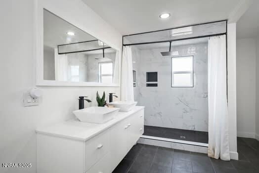 1203 Stanford Way, Sparks, NV 89431 - full bathroom with double vanity, a marble finish shower, tile patterned flooring, and recessed lighting