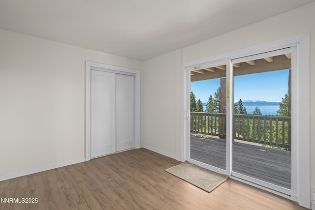 400 Fairview Blvd Unit 20, Incline Village, NV 89451 - unfurnished bedroom with access to exterior, wood finished floors, and a closet