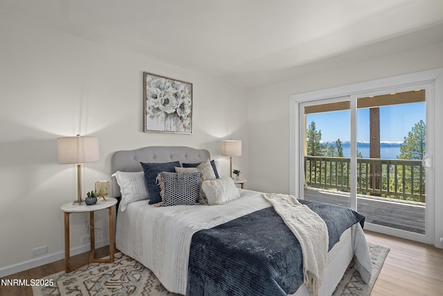 400 Fairview Blvd Unit 20, Incline Village, NV 89451 - bedroom featuring access to exterior, light wood finished floors, and a water view