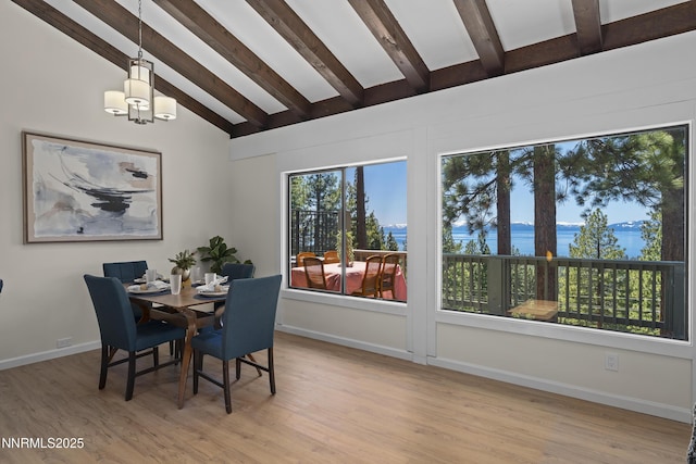 400 Fairview Blvd Unit 20, Incline Village, NV 89451 - dining room with a chandelier, light wood finished floors, and a water view