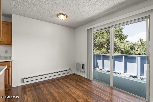 3948 Clear Acre Ln Unit 262, Reno, NV 89512 - unfurnished dining area with a baseboard heating unit, dark wood finished floors, a textured ceiling, and a wall mounted AC