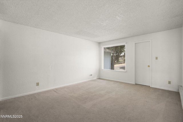 3948 Clear Acre Ln Unit 262, Reno, NV 89512 - carpeted spare room featuring a textured ceiling and baseboards