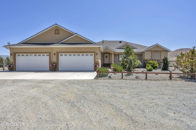 150 Brandon Ranch Ct, Reno, NV 89510 - ranch-style home featuring driveway, stucco siding, and an attached garage