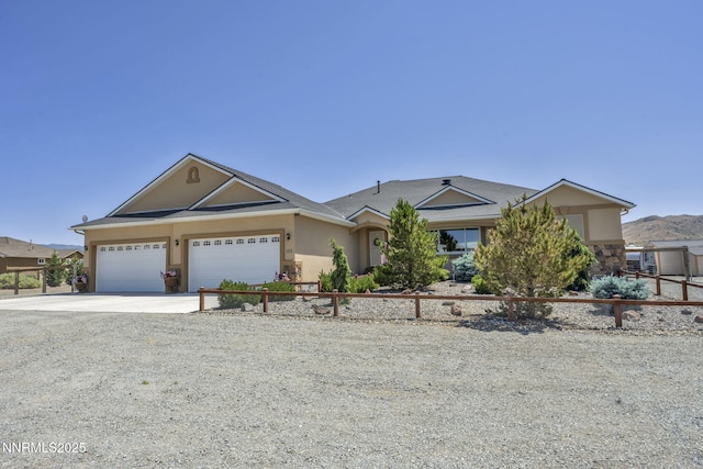 150 Brandon Ranch Ct, Reno, NV 89510 - single story home with driveway, stucco siding, a garage, stone siding, and roof with shingles