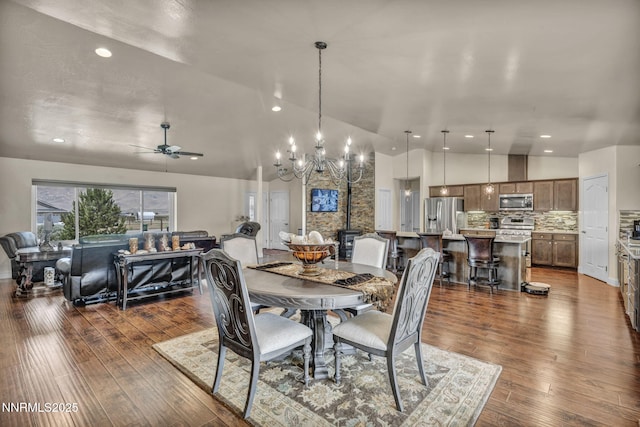 150 Brandon Ranch Ct, Reno, NV 89510 - dining area with a chandelier, wood finished floors, ceiling fan, recessed lighting, and high vaulted ceiling