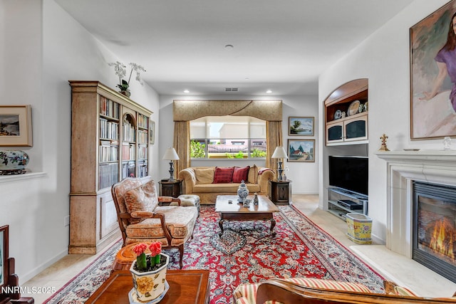 9900 Wilbur May Pkwy Unit 2001, Reno, NV 89521 - living room with a glass covered fireplace, light tile patterned floors, and recessed lighting