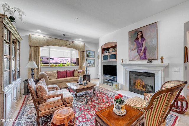 9900 Wilbur May Pkwy Unit 2001, Reno, NV 89521 - living room with a glass covered fireplace, recessed lighting, built in features, and light tile patterned floors