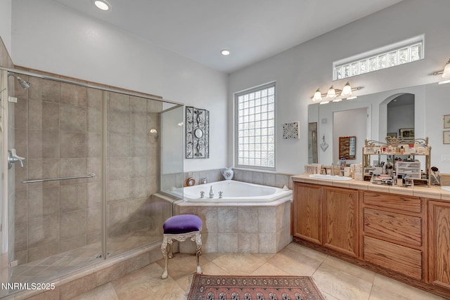 9900 Wilbur May Pkwy Unit 2001, Reno, NV 89521 - bathroom featuring a garden tub, vanity, a shower stall, tile patterned floors, and recessed lighting