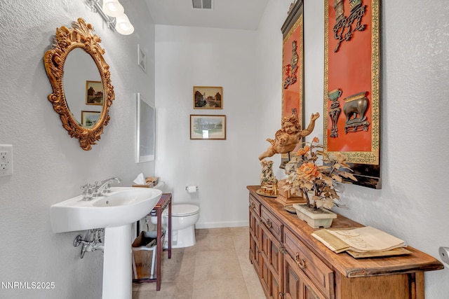 9900 Wilbur May Pkwy Unit 2001, Reno, NV 89521 - bathroom featuring toilet and tile patterned floors