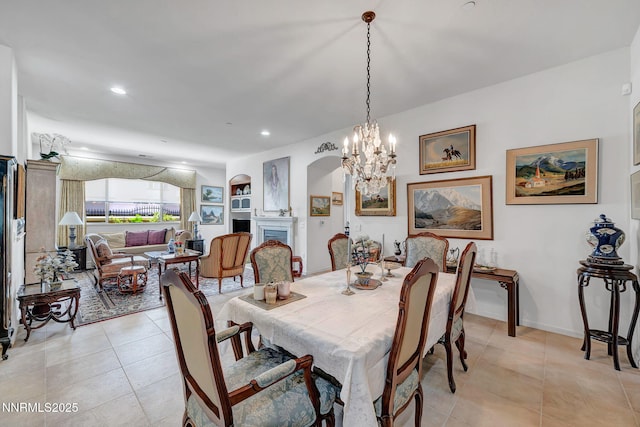 9900 Wilbur May Pkwy Unit 2001, Reno, NV 89521 - dining area with light tile patterned floors, a chandelier, arched walkways, and recessed lighting
