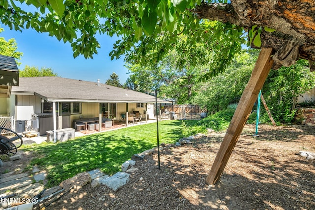 700 Highland St, Carson City, NV 89703 - fenced backyard with a hot tub and a patio area